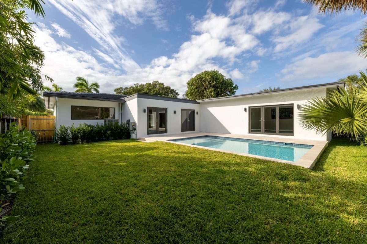 beautiful outdoor pool and lawn